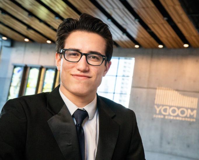 Young male musician wearing formal attire